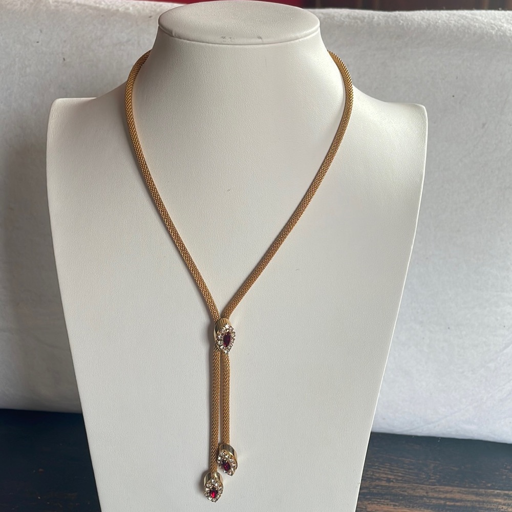 Vintage gold plated Y necklace with red and clear crystal dangle pendants.